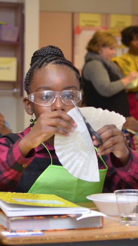 Trinity Wilkins, a fifth-grader at Booker T. Washington Elementary School in Suffolk, Virginia, prepares filter paper to explore the chromatography of candy as part of the BASF Kids’ Lab during National Chemistry Week.