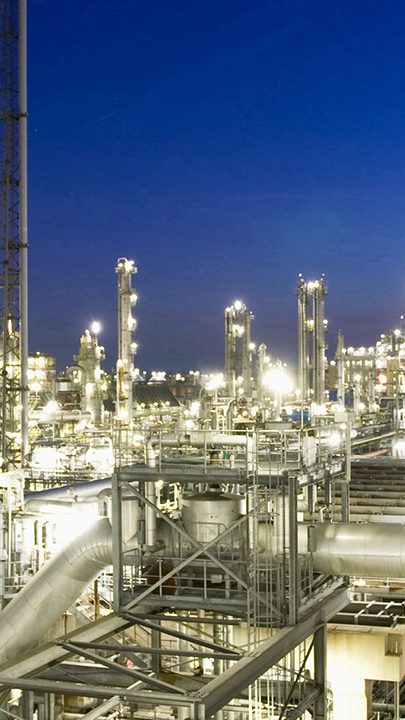 Production factory with bright lights at night 
